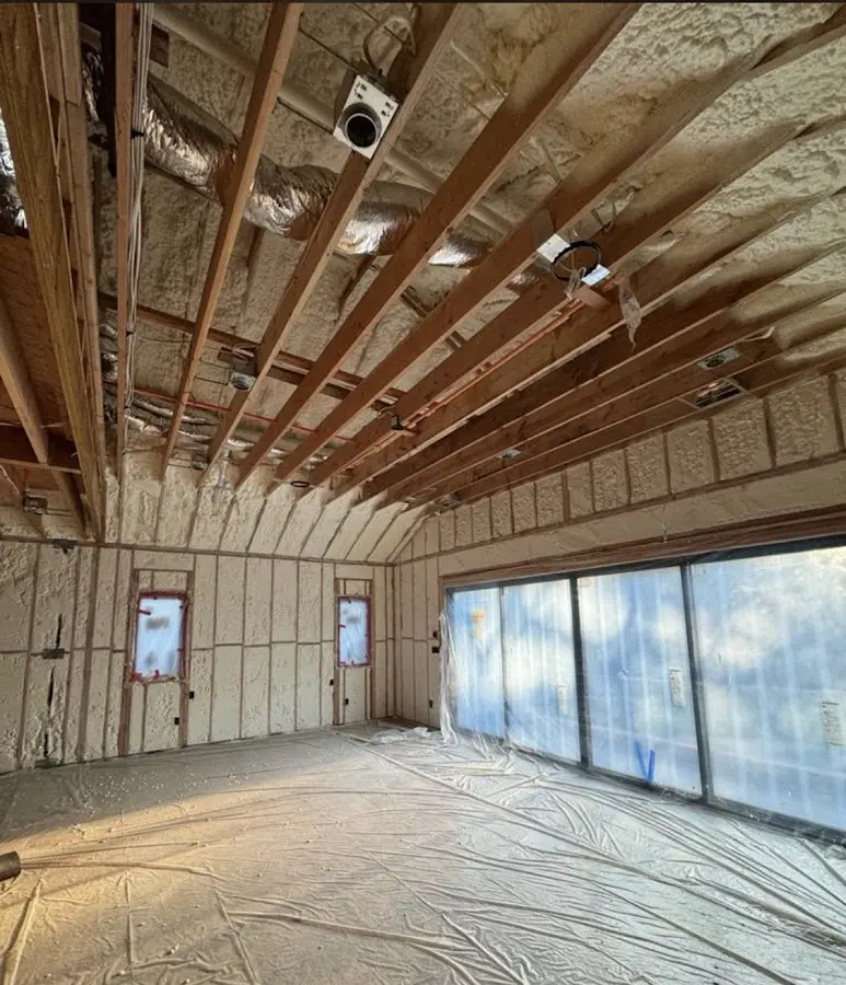 Interior walls and ceiling insulated with spray foam during new construction in Chippewa